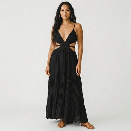 Model wearing a Lynn's Closet Boutique black Jonathan Simkhai pleated floor-length gown with side cut-outs