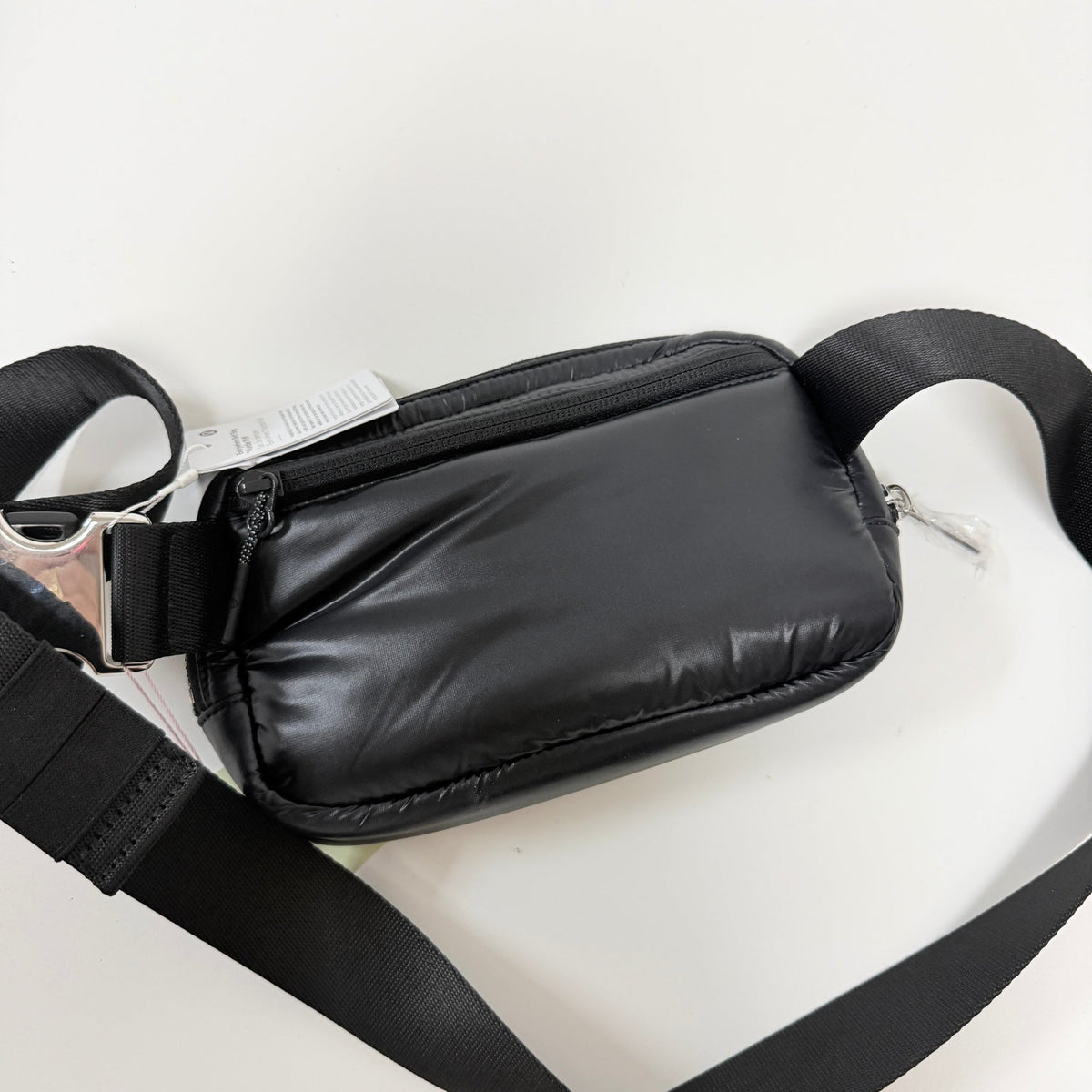 Lynn's Closet Boutique Lululemon Everywhere Belt Bag in black puffer style with adjustable strap and zippered pockets.