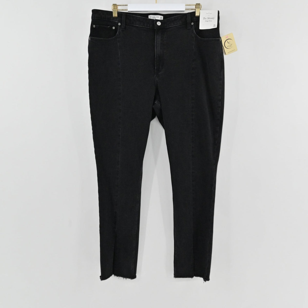 Lynn's Closet Boutique A&F Curve Love black high-rise skinny jeans with front seam detail and raw-edge hem.