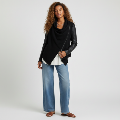 Model wearing a Lynn's Closet Boutique Blank NYC black faux leather moto jacket with an asymmetrical draped front.