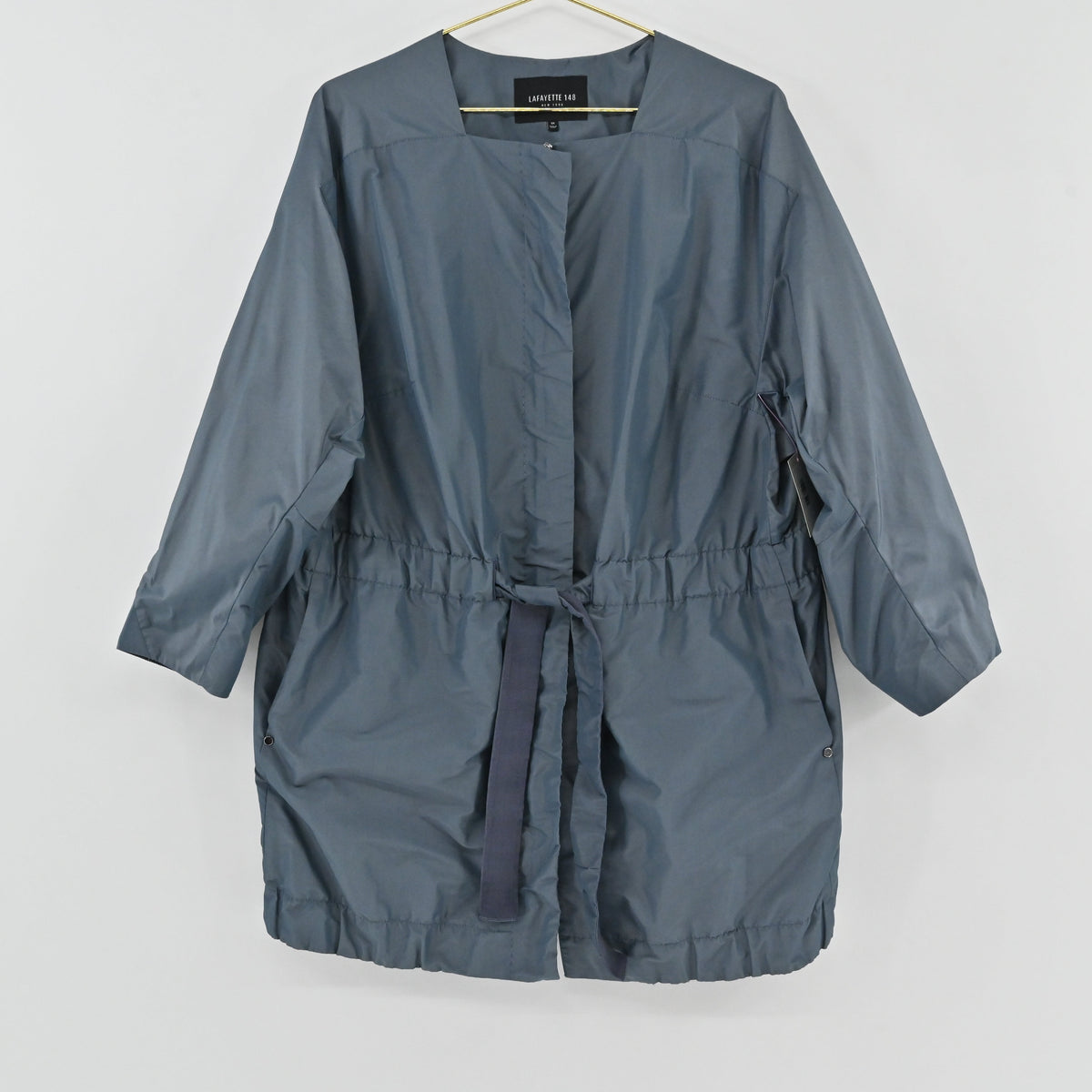 Lynn's Closet Boutique Lafayette 148 NY blue-gray metallic drawstring jacket with a collarless neckline.