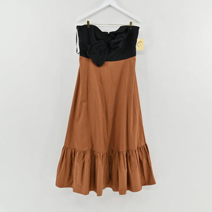 Lynn's Closet Boutique strapless midi dress with a black bodice, brown skirt, and oversized bow detail at the bust.