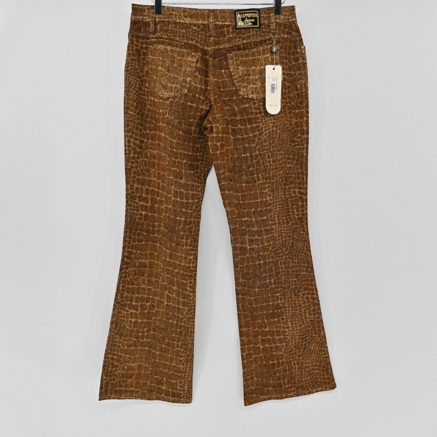 Lynn's Closet Boutique Cappopera brown croc-embossed jeans with back pockets and brand tag hanging on a hanger.