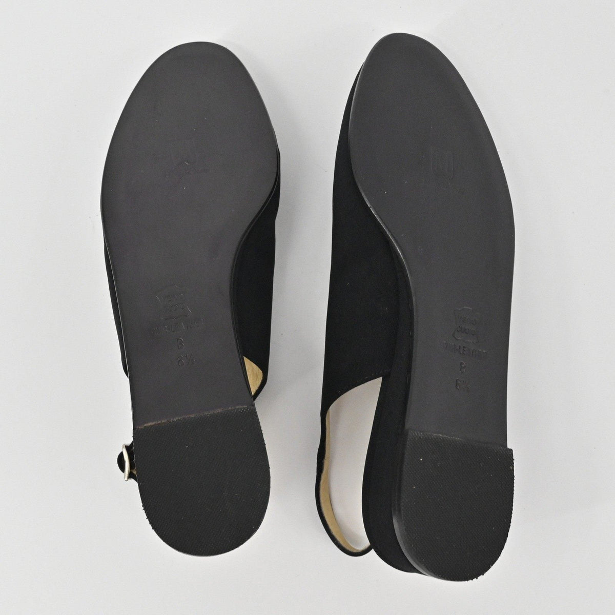 Lynn's Closet Boutique Bruno Magli black leather slingback flats showing the smooth soles and low heels
