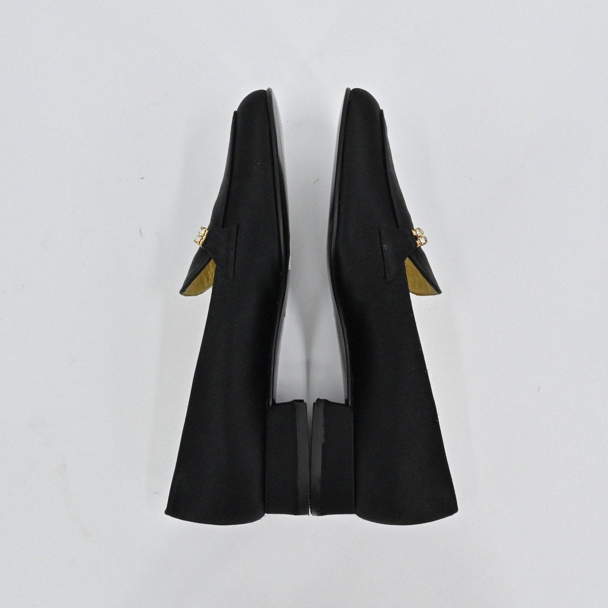 Lynn's Closet Boutique Bruno Magli black satin loafers with rhinestone embellishment and low block heel, top view.