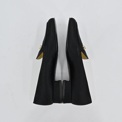 Lynn's Closet Boutique Bruno Magli black satin loafers with rhinestone embellishment and low block heel, top view.