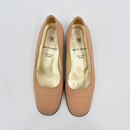 Lynn's Closet Boutique Bruno Magli tan leather loafer pumps with embossed logo and gold interior, top view.