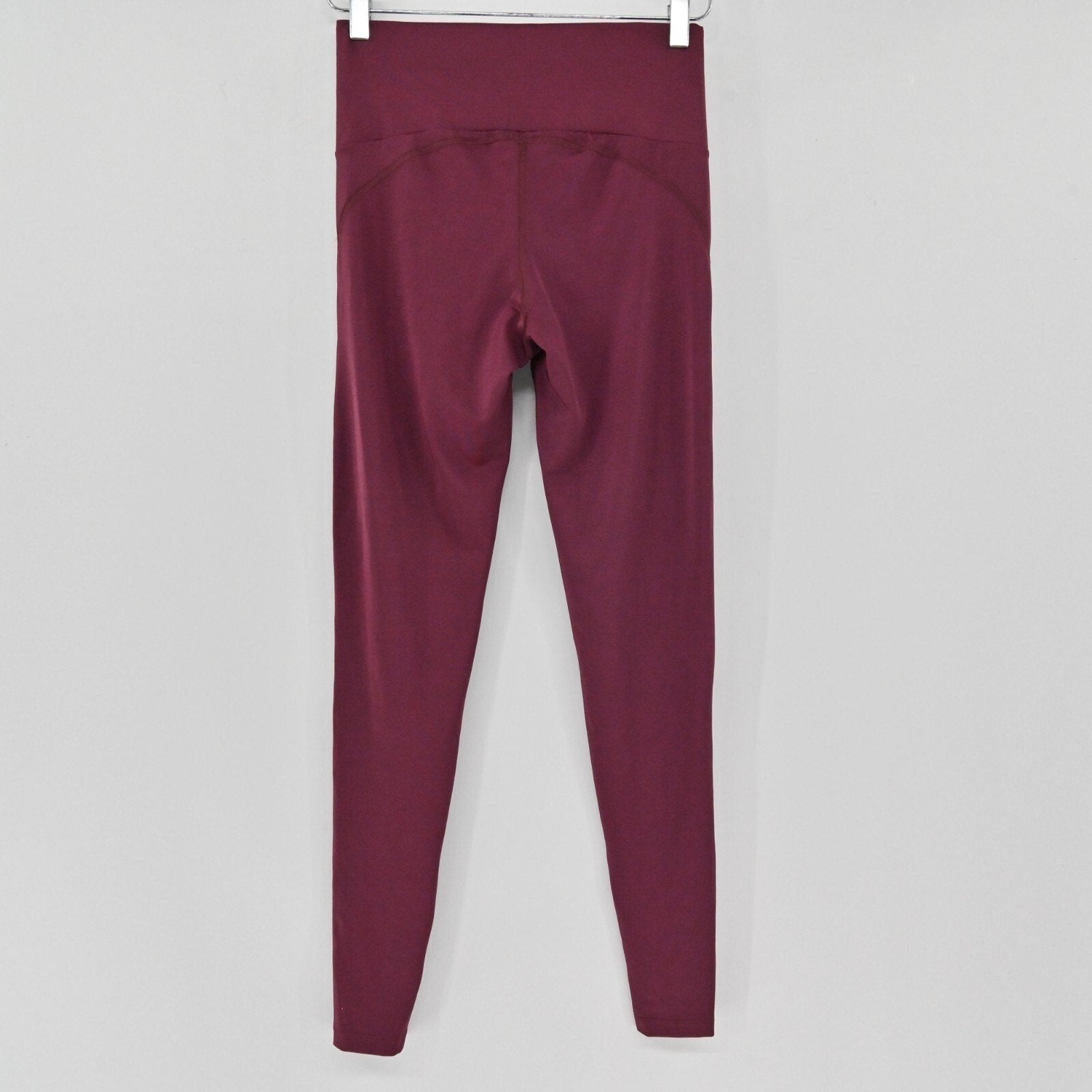 Lynn's Closet Boutique Maaji Vienna Balcony Dazeful high-waisted leggings in deep burgundy moisture-wicking fabric.