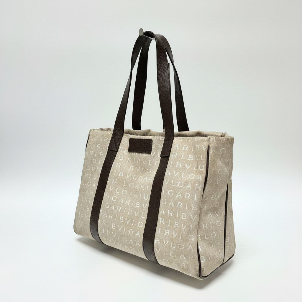 Lynn's Closet Boutique Bvlgari Logomania beige canvas tote bag with brown leather handles and logo print pattern.