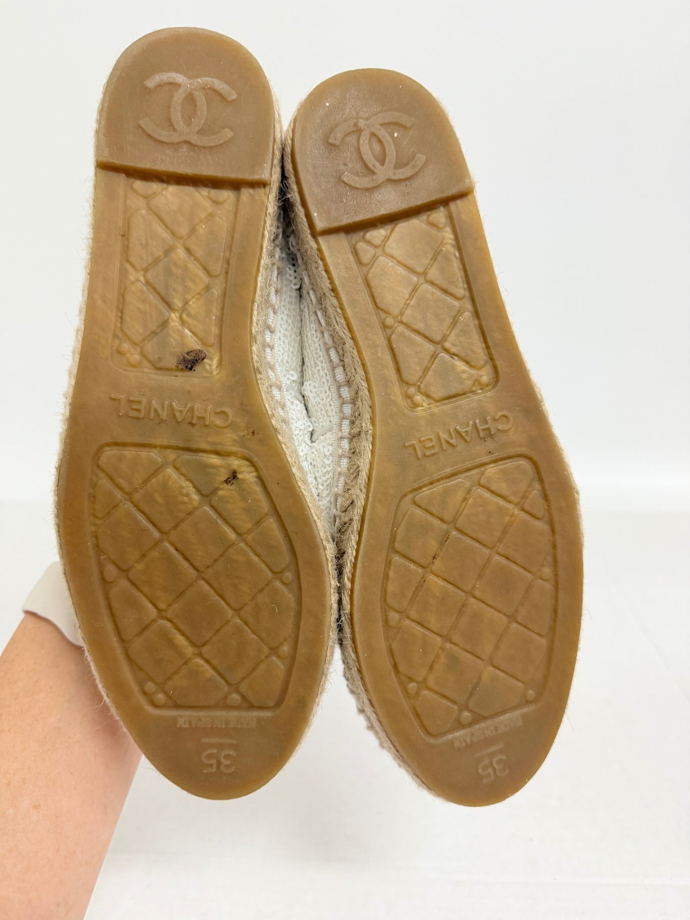 Lynn's Closet Boutique Chanel white sequin espadrilles showing the rubber soles with CC logo and size 35 branding