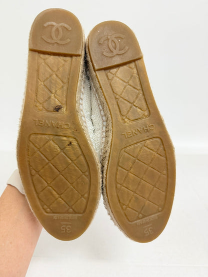 Lynn's Closet Boutique Chanel white sequin espadrilles showing the rubber soles with CC logo and size 35 branding