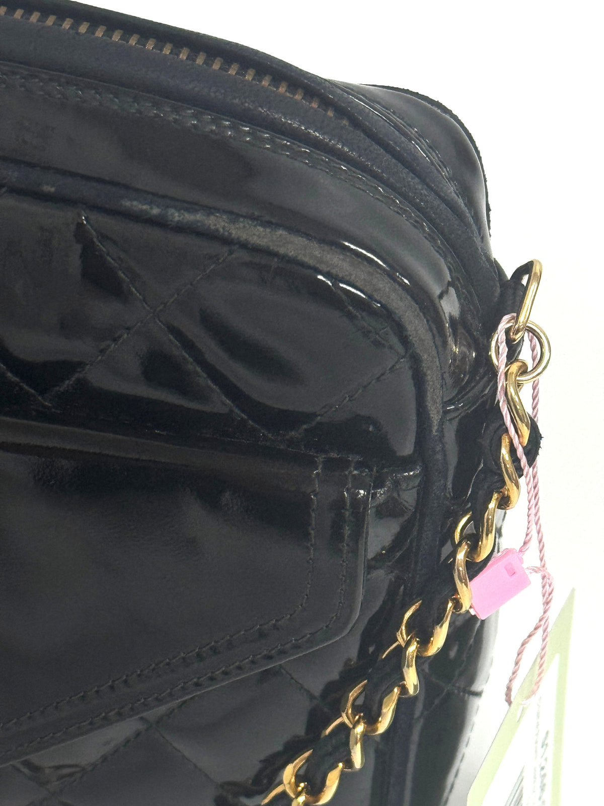 Lynn's Closet Boutique black quilted patent leather Chanel camera bag with gold chain strap and side detail