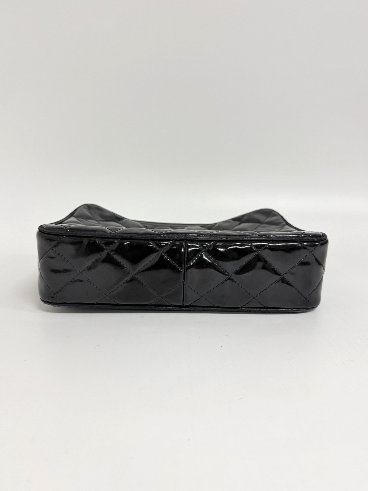 Lynn's Closet Boutique black quilted patent leather Chanel camera bag base view showing diamond stitching pattern