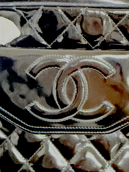 Lynn's Closet Boutique black quilted patent leather Chanel camera bag featuring the iconic interlocking CC logo