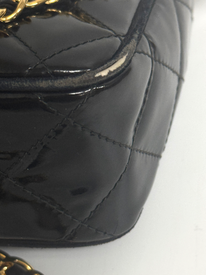 Lynn's Closet Boutique black quilted patent leather Chanel camera bag corner showing vintage wear and gold hardware