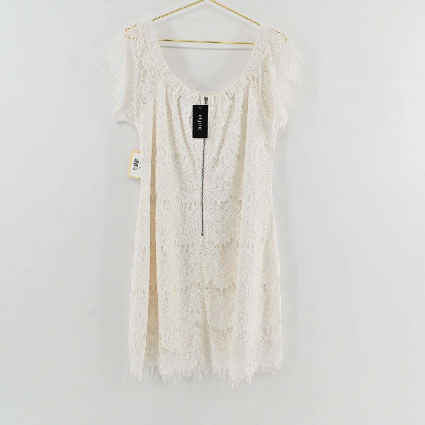 Lynn's Closet Boutique City Chic white lace off-the-shoulder dress with short sleeves and scalloped hem, size 16.