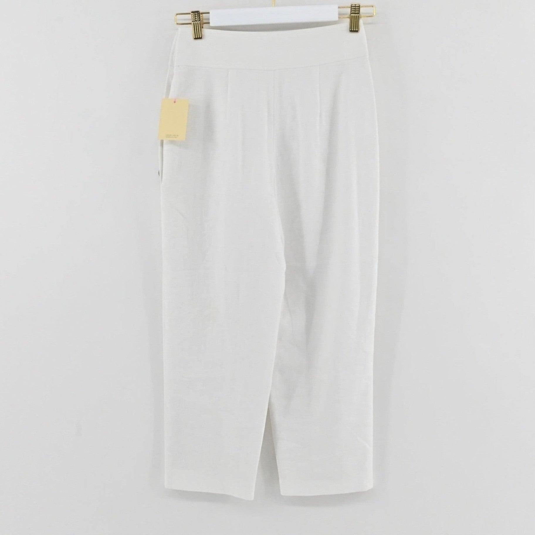 Lynn's Closet Boutique Club Monaco white high-waisted linen-blend cropped trousers with side button detail.