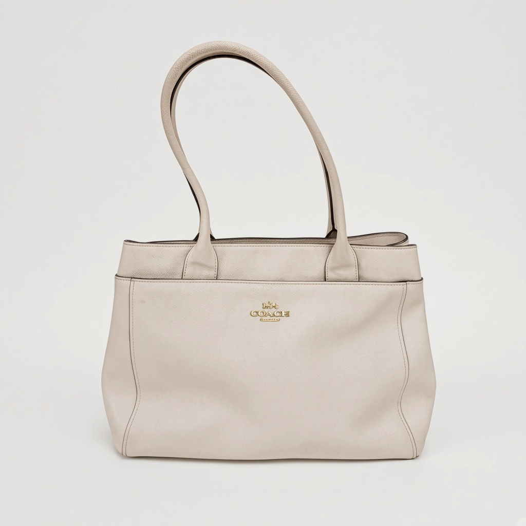 Lynn's Closet Boutique Coach Casey tote bag in chalk crossgrain leather with gold-tone hardware and shoulder straps.