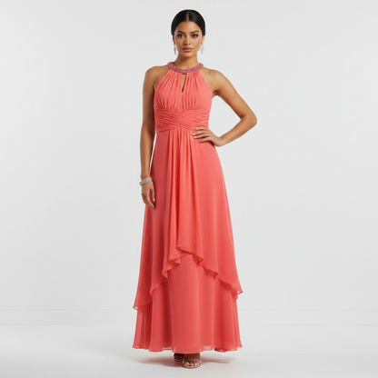 Lynn's Closet Boutique coral chiffon high-low halter dress with an embellished neckline and ruched bodice on a model