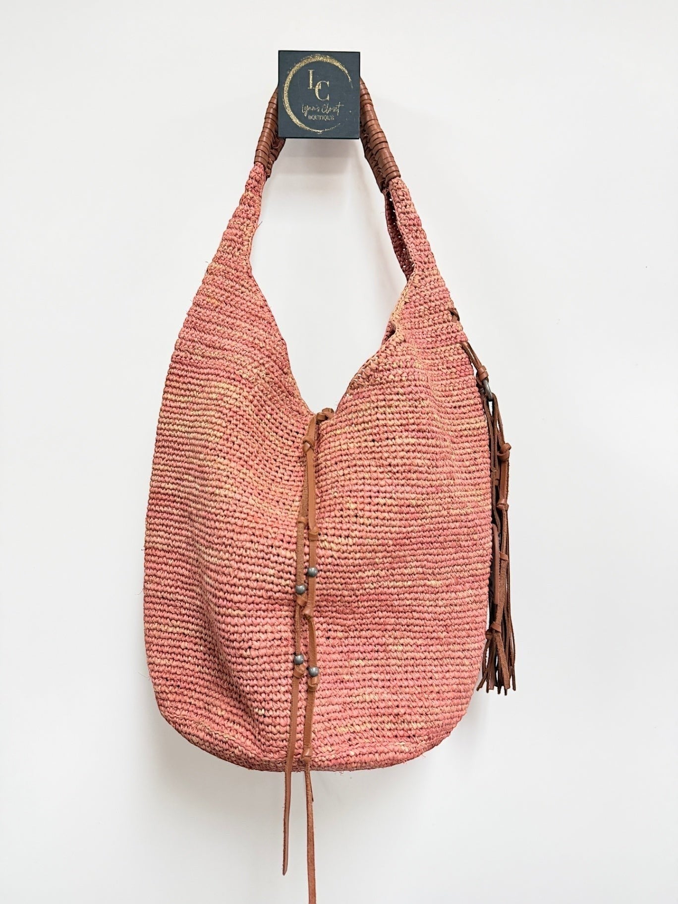 Lynn's Closet Boutique Polo Ralph Lauren coral raffia hobo bag with brown leather braided handle and tassel detail