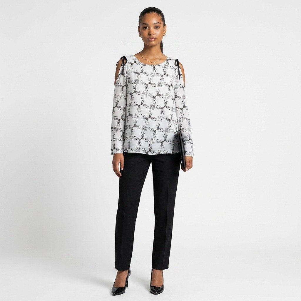 Lynn's Closet Boutique Dorothee Schumacher top with black and white botanical print and cold-shoulder ribbon ties.