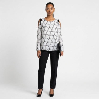 Lynn's Closet Boutique Dorothee Schumacher top with black and white botanical print and cold-shoulder ribbon ties.