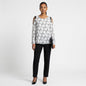 Lynn's Closet Boutique Dorothee Schumacher top with black and white botanical print and cold-shoulder ribbon ties.