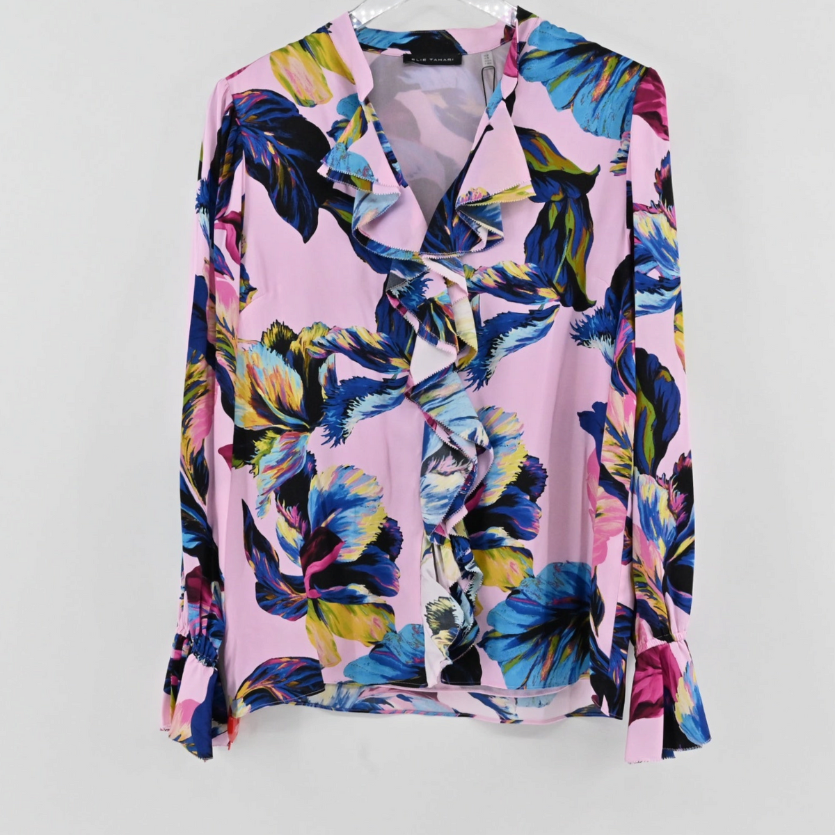 Lynn's Closet Boutique Elie Tahari silk-blend floral blouse with ruffled placket and cuffs in pink, blue, and yellow.