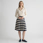 Lynn's Closet Boutique Ellen Tracy knee-length pleated silk skirt with navy and cream stripes and side button detail.