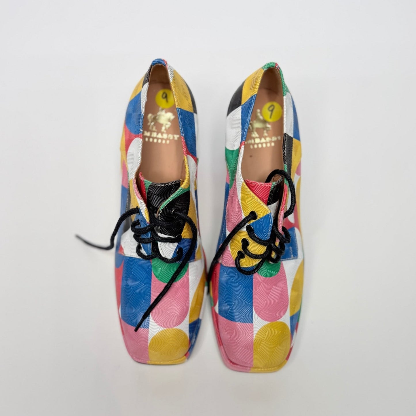 Lynn's Closet Boutique Embassy London Roulette platform lace-up shoes with a vibrant multi-colored geometric pattern.