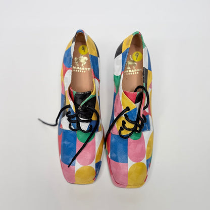 Lynn's Closet Boutique Embassy London Roulette platform lace-up shoes with a vibrant multi-colored geometric pattern.