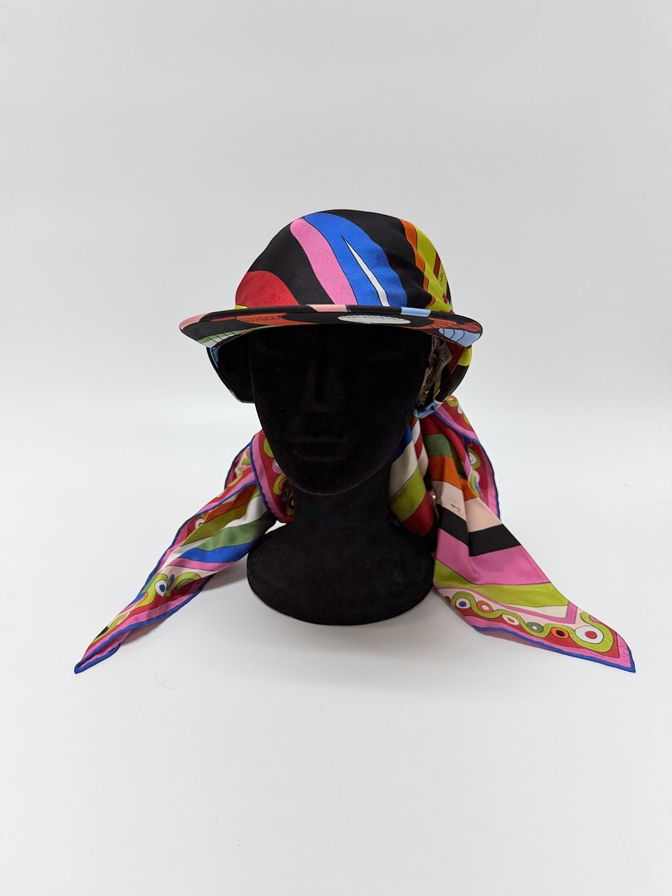 Lynn's Closet Boutique Emilio Pucci silk twill hat with a vibrant kaleidoscopic print in black, pink, blue, and yellow.