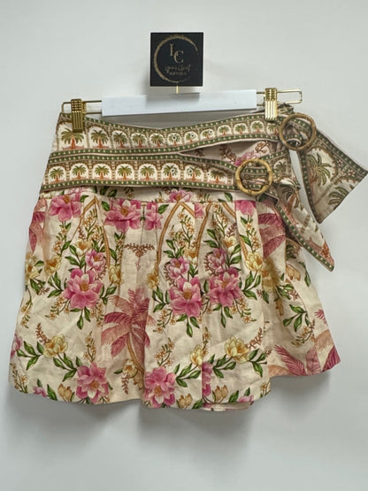 Lynn's Closet Boutique Farm Rio linen mini skirt with palm and floral print, double waistband, and circular buckles.