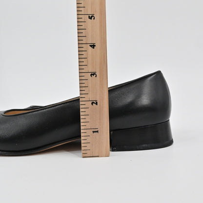 Lynn's Closet Boutique Salvatore Ferragamo black leather pump showing low block heel height with a wooden ruler