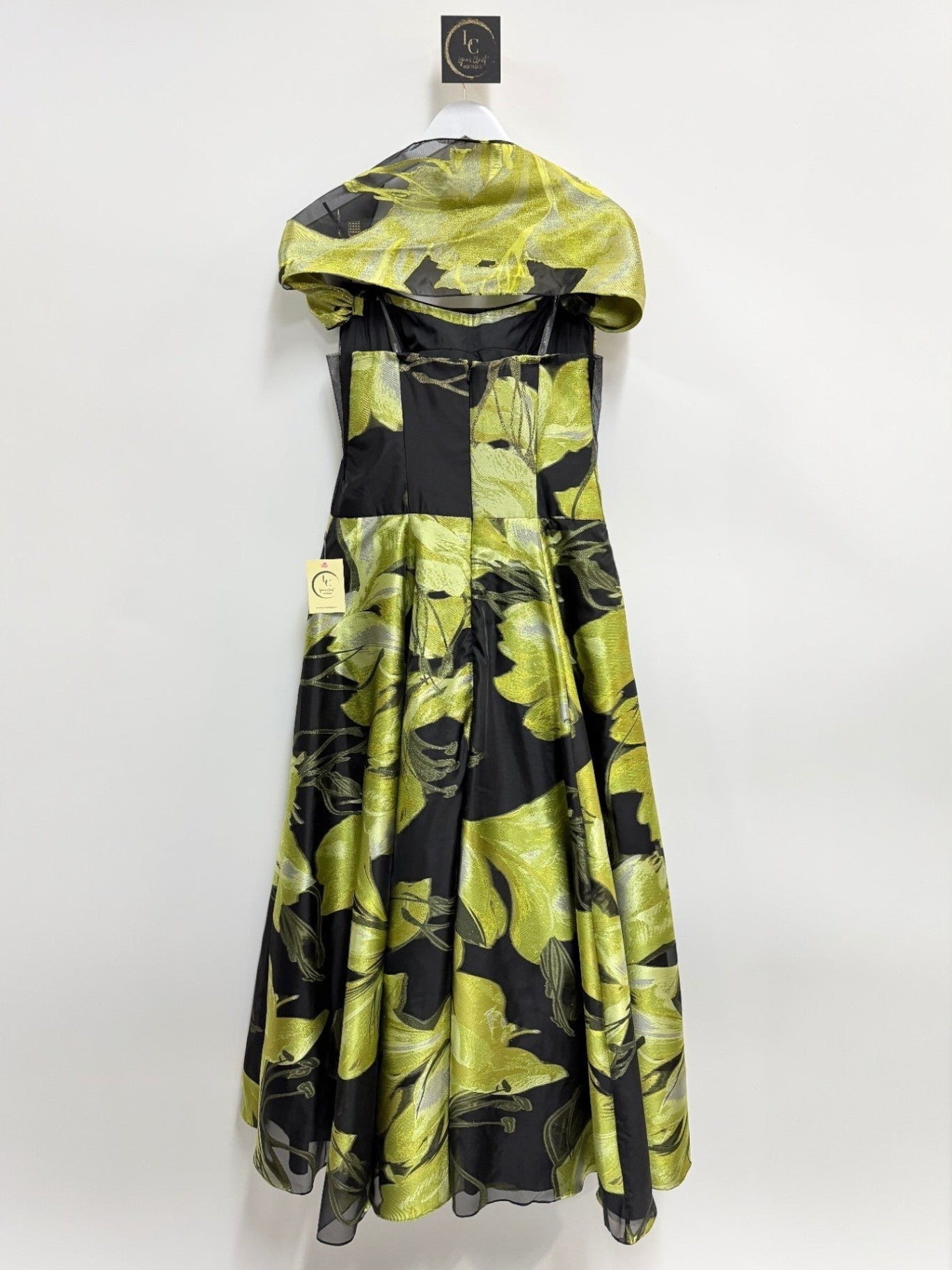 Lynn's Closet Boutique strapless A-line formal gown in black with shimmering lime green floral print and matching wrap.