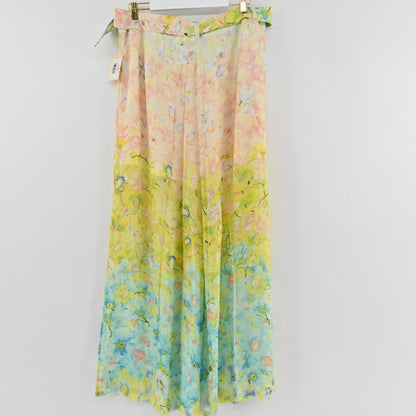 Lynn's Closet Boutique floral pleated wide-leg pants in a watercolor peach, yellow, and blue gradient print.