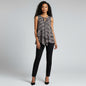 Model wearing a Lynn's Closet Boutique Derek Lam 10 Crosby floral silk sleeveless tiered top with black trousers.