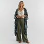 Model wearing a Lynn's Closet Boutique velvet burnout floral shawl with blue blossoms and scalloped lace trim.