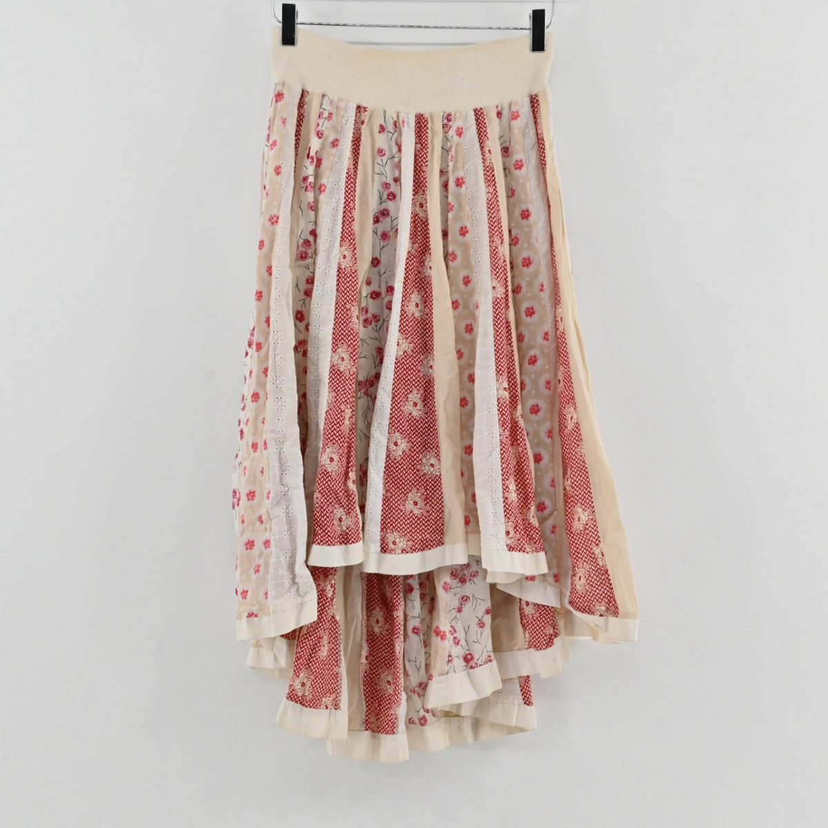 Lynn's Closet Boutique Free People boho high-low skirt with cream and red floral patchwork and elasticized waistband.