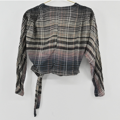 Lynn's Closet Boutique Free People plaid wrap top with long sleeves, shirred shoulders, and a side tie in a gradient.