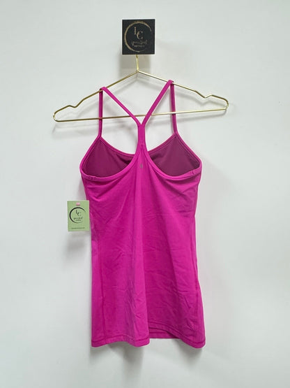 Lynn's Closet Boutique fuchsia Lululemon Power Y tank top with signature Y-back design hanging on a gold hanger.