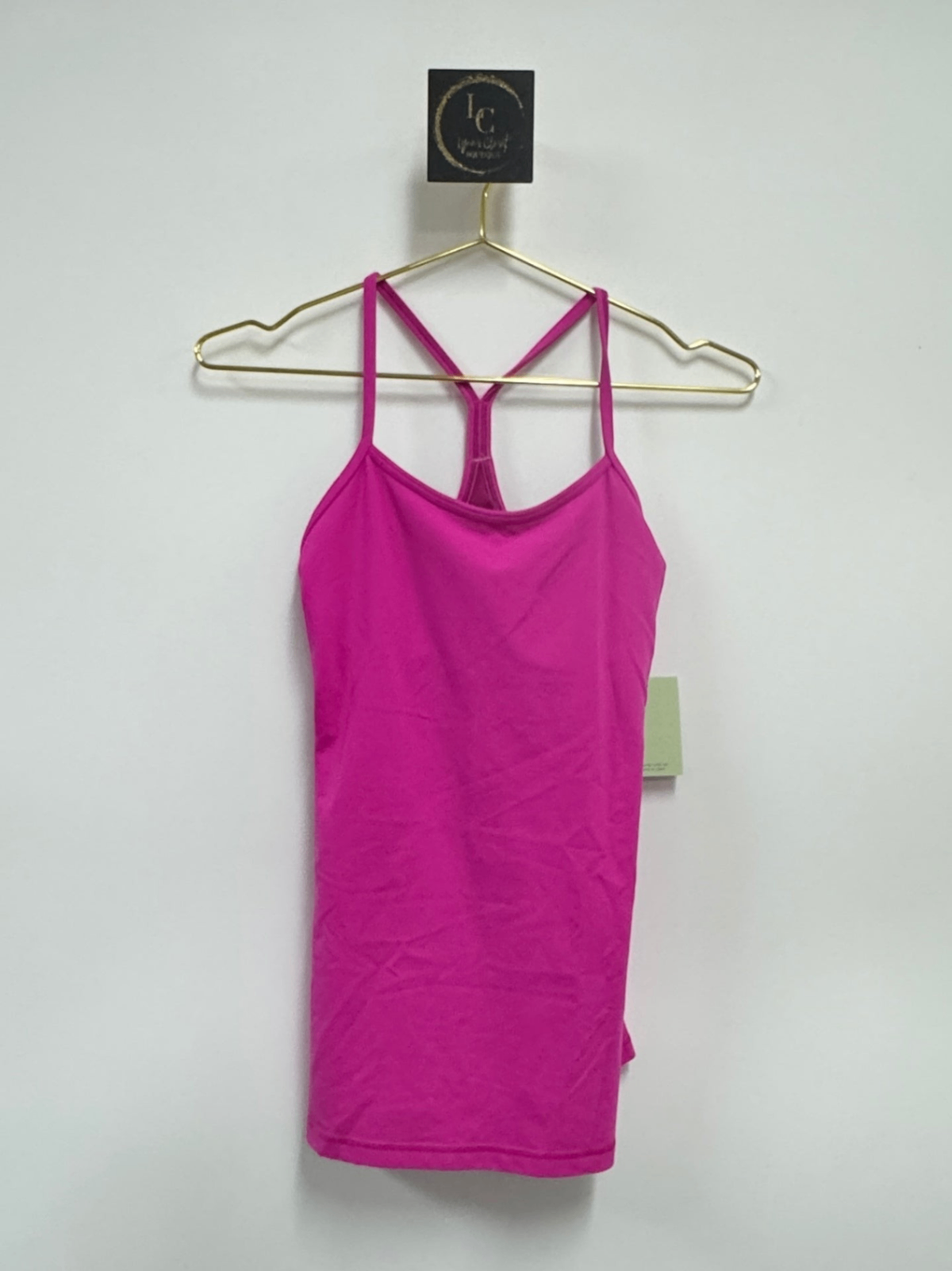 Lynn's Closet Boutique fuchsia Lululemon Power Y tank top with signature Y-back straps on a gold hanger