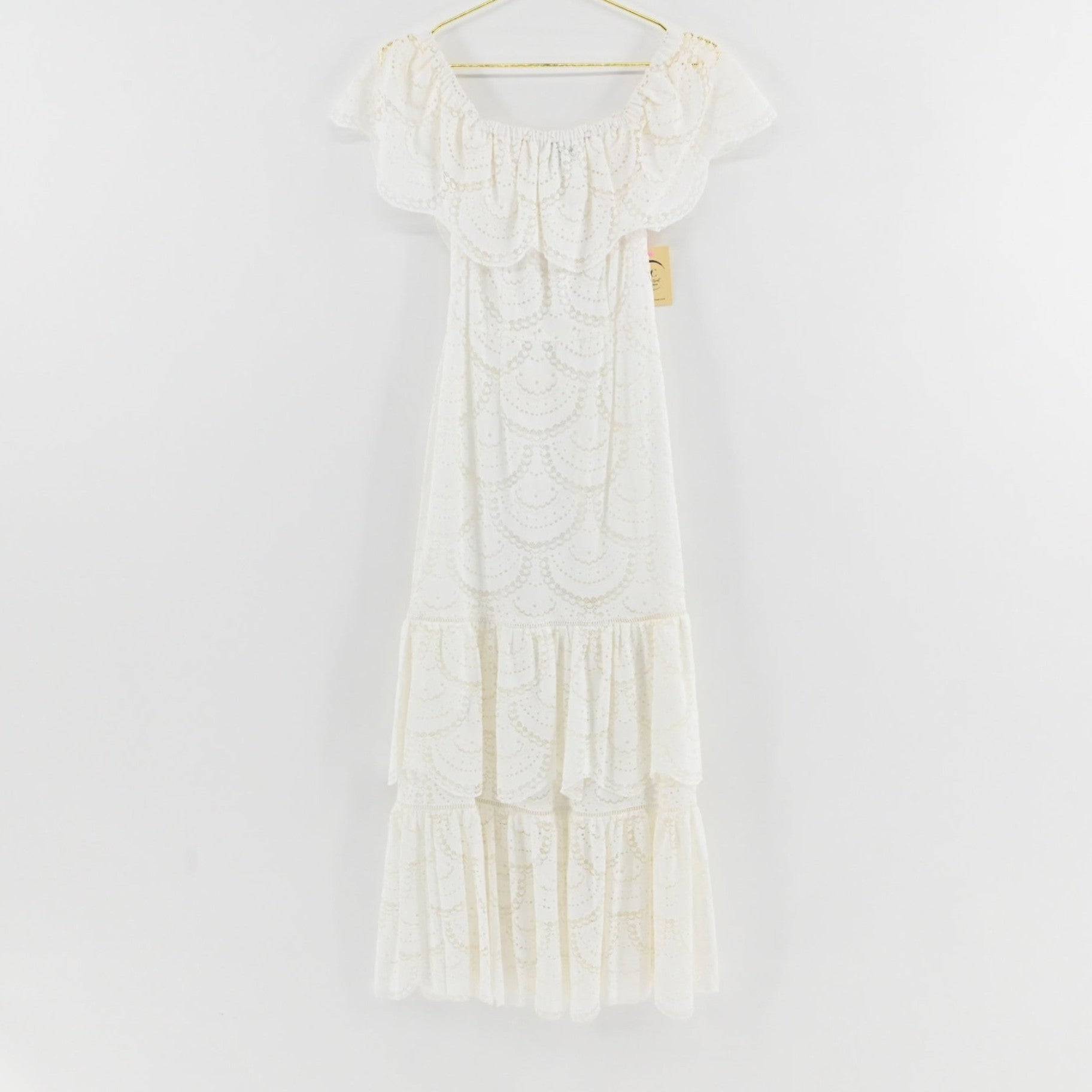 Lynn's Closet Boutique Gianni Bini white midi dress featuring scalloped lace, off-the-shoulder neckline, and tiered skirt.