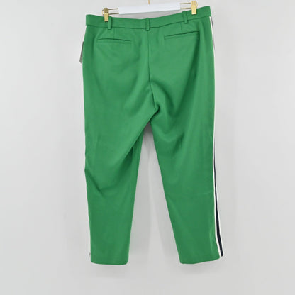 Lynn's Closet Boutique green Tory Burch Sport trousers featuring a side stripe and tailored fit on a white background.
