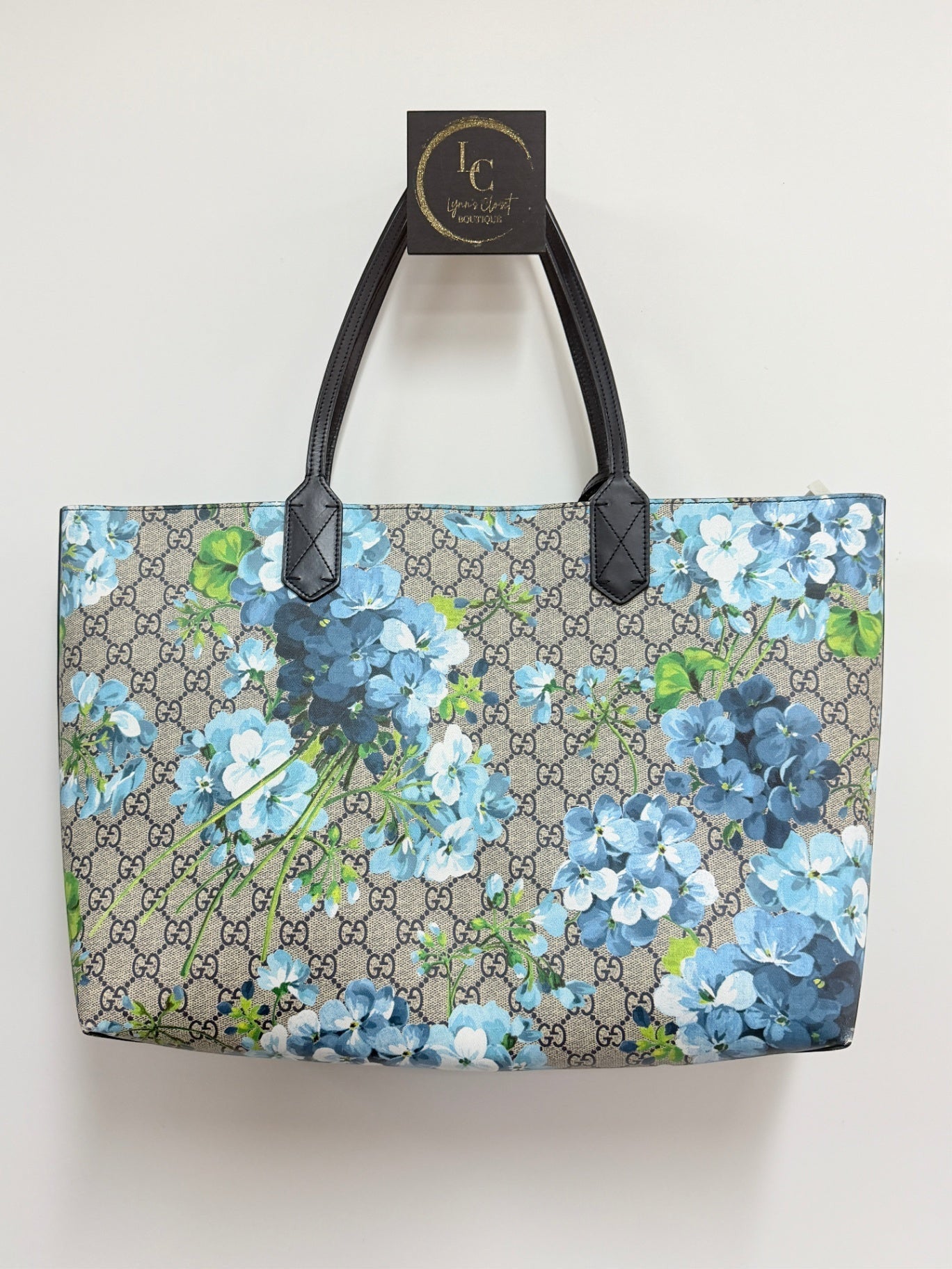 Lynn's Closet Boutique Gucci GG Supreme Blooms reversible tote in beige monogram canvas with blue floral print.