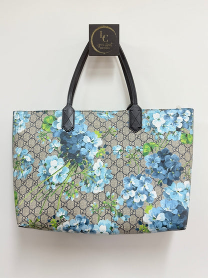 Lynn's Closet Boutique Gucci GG Supreme Blooms reversible tote in beige monogram canvas with blue floral print.