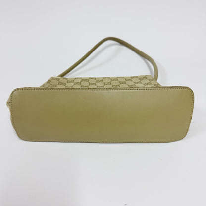 Lynn's Closet Boutique vintage Gucci GG canvas shoulder bag showing the smooth beige leather base and monogram pattern