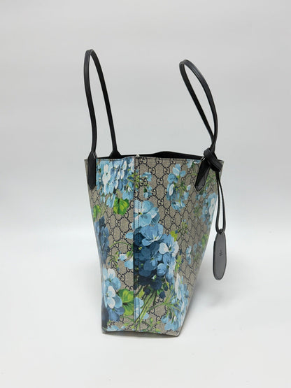 Lynn's Closet Boutique Gucci GG Supreme Blooms reversible tote in beige monogram canvas with blue floral print.