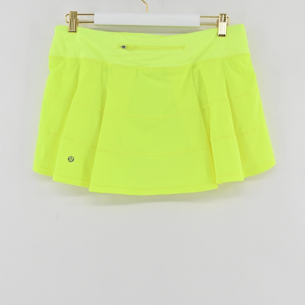 Lynn's Closet Boutique Lululemon Pace Rival mid-rise athletic skirt in highlighter yellow with a back zipper pocket