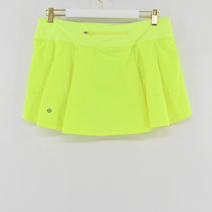 Lynn's Closet Boutique Lululemon Pace Rival mid-rise athletic skirt in highlighter yellow with a back zipper pocket